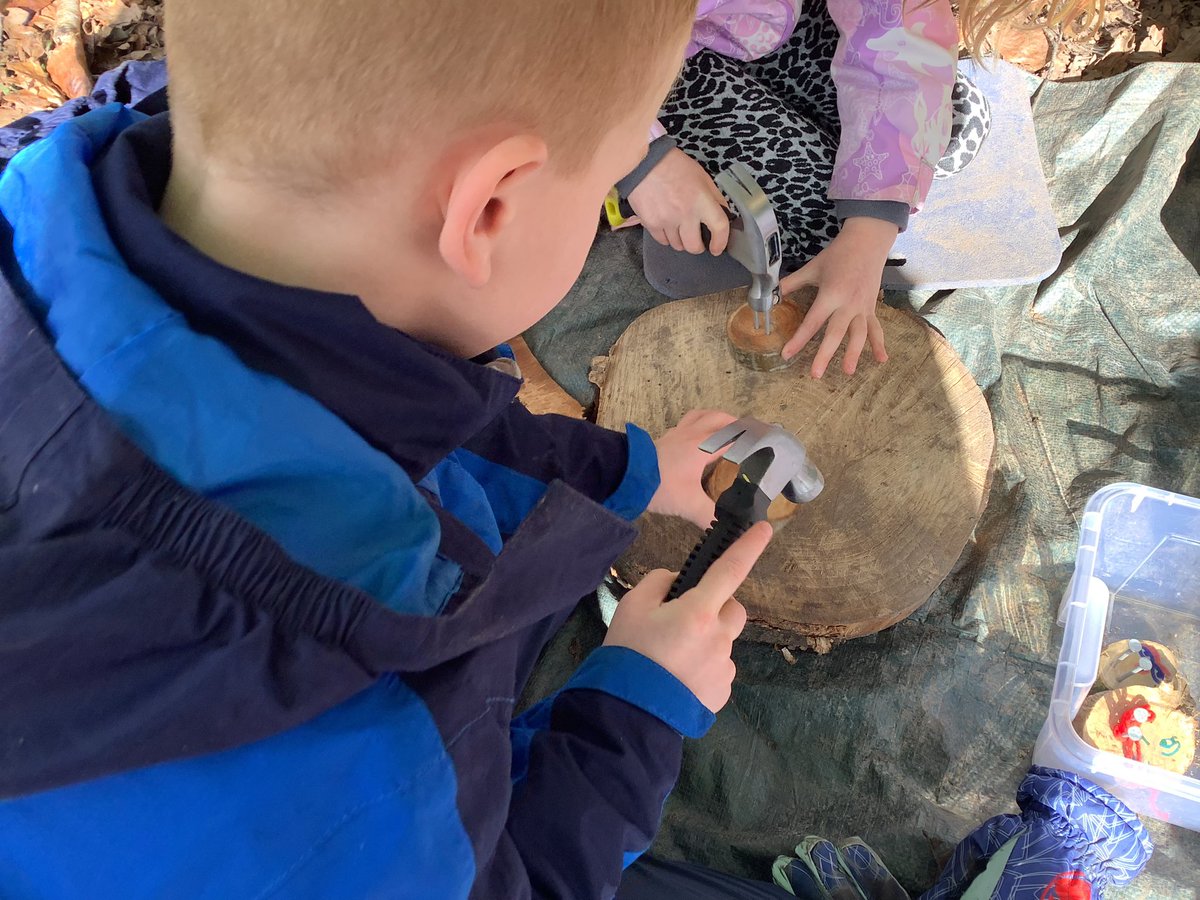 StPhilipsY2C's tweet photo. We had a fabulous morning yesterday at forest school. We used hammers and nails to make the face of the Green Man who brings the spring to the forest! @StPhilipCEAP https://t.co/GqvTzwK80F