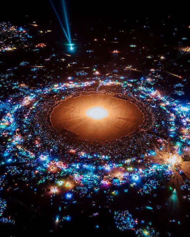 Rainmaker1973's tweet photo. It might look like a solar system or a galaxy, but this actually a view of the Burning Man shot from a drone in 2019

[source: https://t.co/2t5gqTPswq] https://t.co/TyQ0GvQ2za