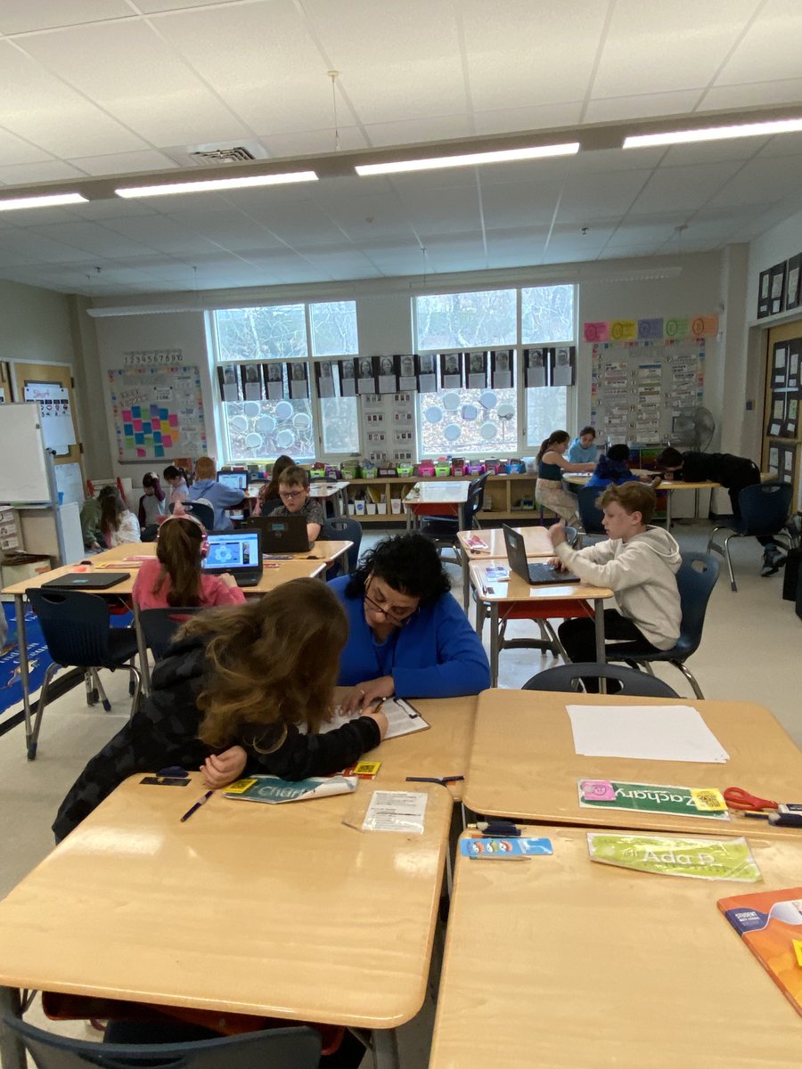 V-O 3rd graders working on fractions in different learning stations.