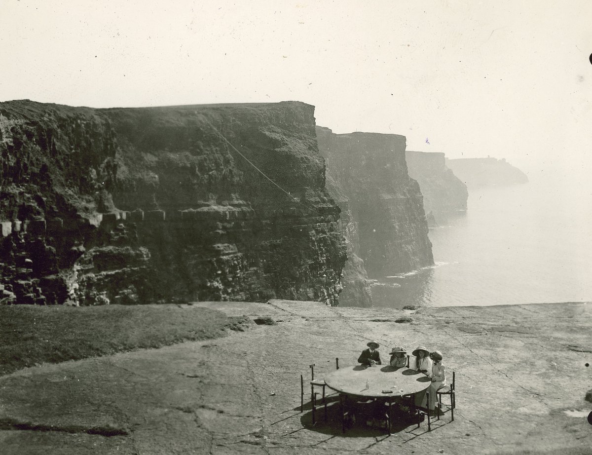 There was no safety barriers at the Cliffs of Moher in 1917! There was however a picnic table with incredible views. Seated were 4 teenage siblings, Michael, Ada, Eva and Morlin McNamara. Their father George took the photo &amp;was the resident Doctor in Corofin (Photo: Clare Library