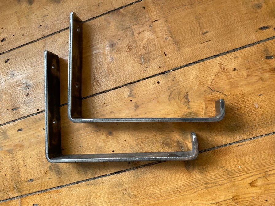 Shelf brackets to suit scaffolding board. 6mm thick 40mm wide. Self colour to put your own finish on.