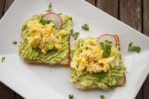 Avocado toast is a popular sandwich option that's both tasty and nutritious. Top with fresh veggies and a sprinkle of seasoning for added flavor.