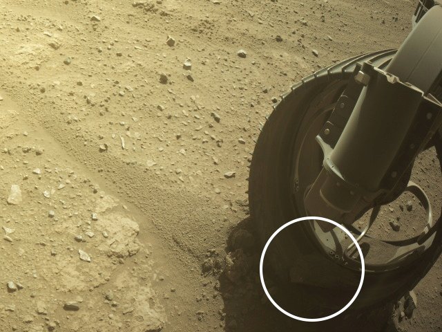 NASAPersevere's tweet photo. You might know I carry a “pet rock” in my left front wheel, which tumbled in there over a year ago. But did you know others have joined the journey too? I’ve picked up two additional hitchhikers, in my right front and rear wheels. Fine by me – let’s keep rolling! https://t.co/YFg62M6CBC
