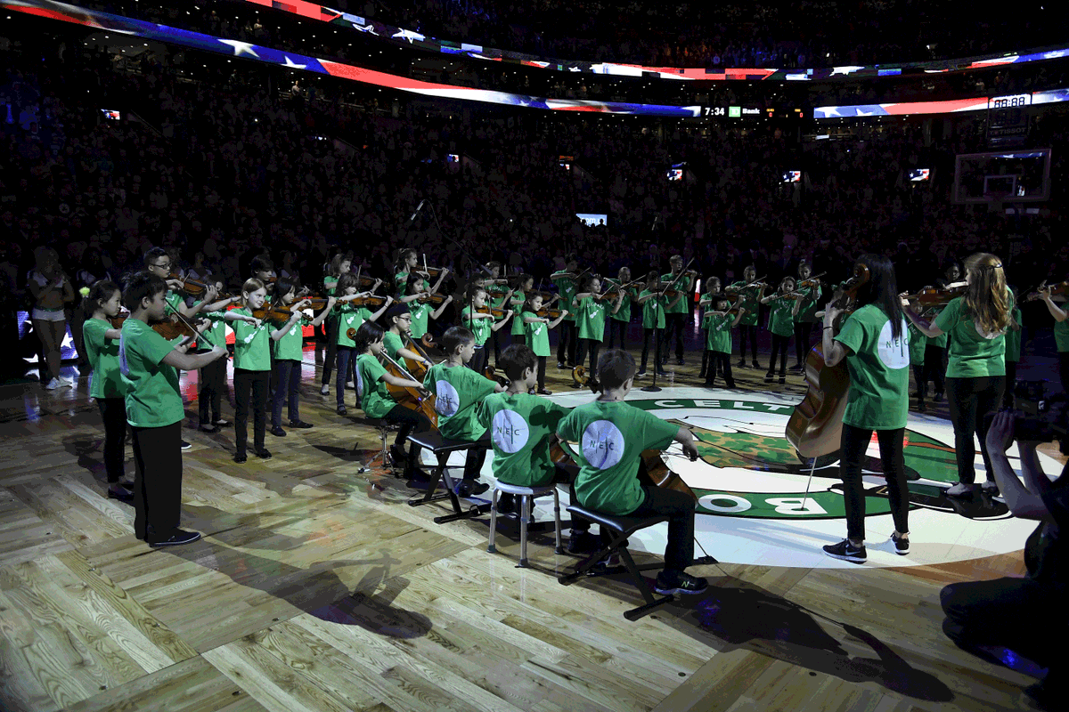 NECPrep's tweet photo. Flashback to the incredible performance by NEC's youngest musicians performing the National Anthem before a Celtics game in 2019! 🎶🏀 

We're feeling nostalgic for this unforgettable moment and can't wait to relive it next Friday when 42 students return to the court! 🍀 https://t.co/Y2BPyOy7Jb