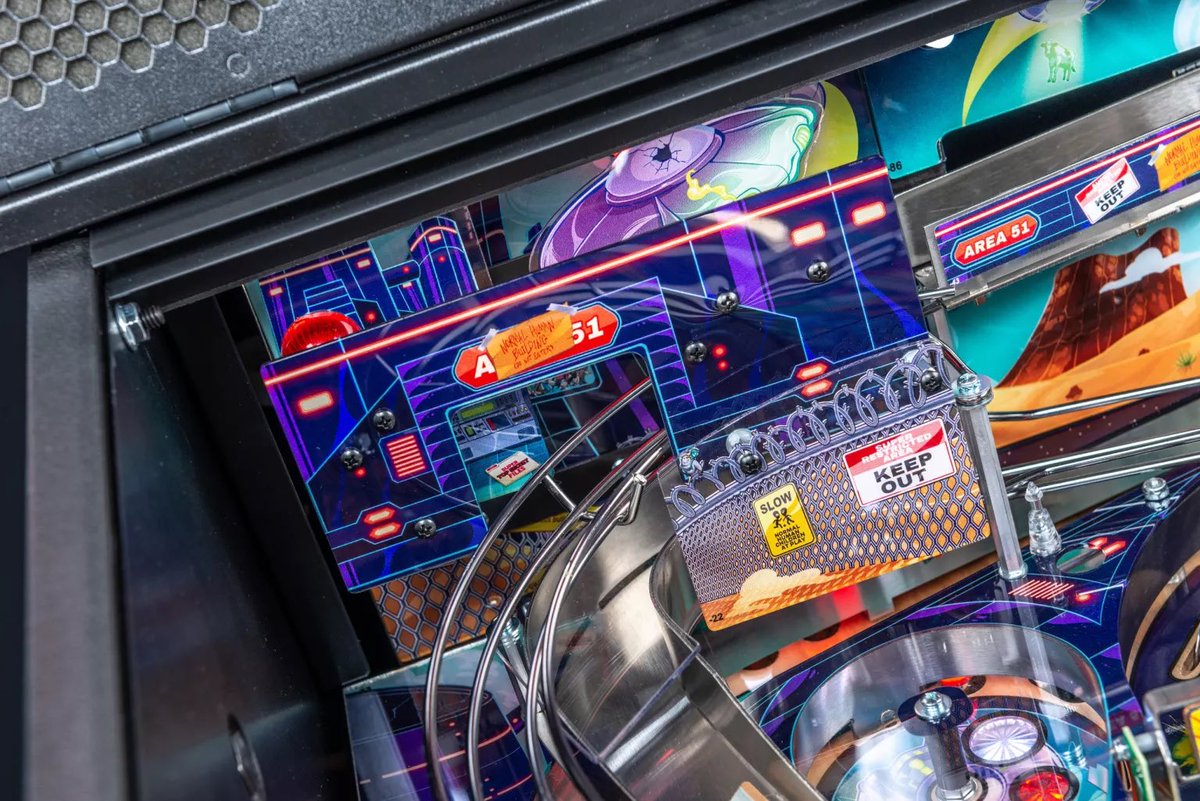 DeadFlip's tweet photo. Dreaming up the “Area 51” for the pro model of Foo Fighters #pinball.

I knew I wanted to fill this space in, since we didn’t have the upper playfield, but I wanted something more than just a flat plastic.

A stack of plastics that the ball could go THROUGH was the goal, to give the feel of coming through the doors of Area 51.

Mix that with awesome @zombieyeti art, and you get this bad boy! ❤️