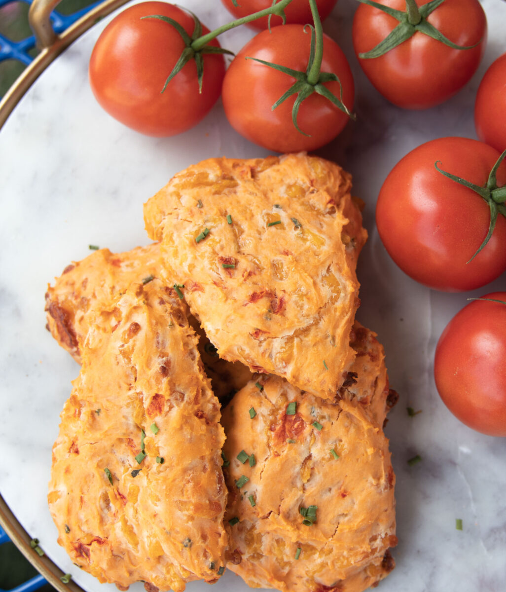 gardenandgun's tweet photo. A mom-and-pop coffeehouse serves grab-and-go versions of a Southern favorite. Get their recipe for tomato pie scones: https://t.co/qzU1ZaIT8f https://t.co/4WYsnPJIND