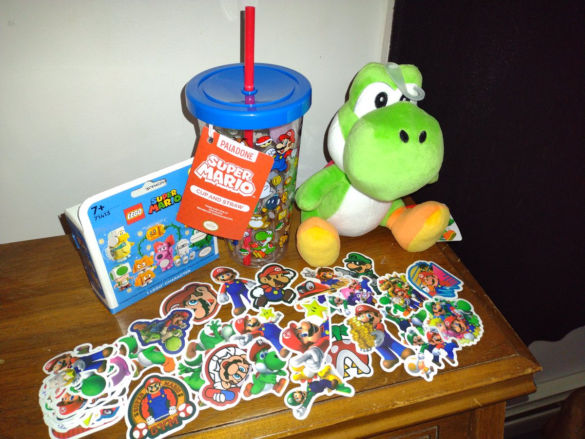 stargazingyoda's tweet photo. For those wanting to see what the winning Mario Bundle was from @MidlifeSQ here it is!! So cool! It's awesome, Yoshi was always my favorite! I had to put him high up on a shelf so the pup wouldn't get em. #mariowaterbottle #yoshiplush #legomario #mariostickers #mariobundle #mario https://t.co/reDMhU1vlX
