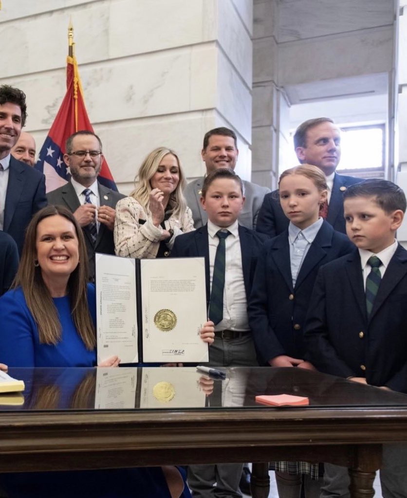 Left: Minnesota Governor Tim Walz after signing a law that guarantees free breakfast and lunch to all public school students Right: Arkansas Governor Sarah Huckabee Sanders after signing a law that makes child labor easier