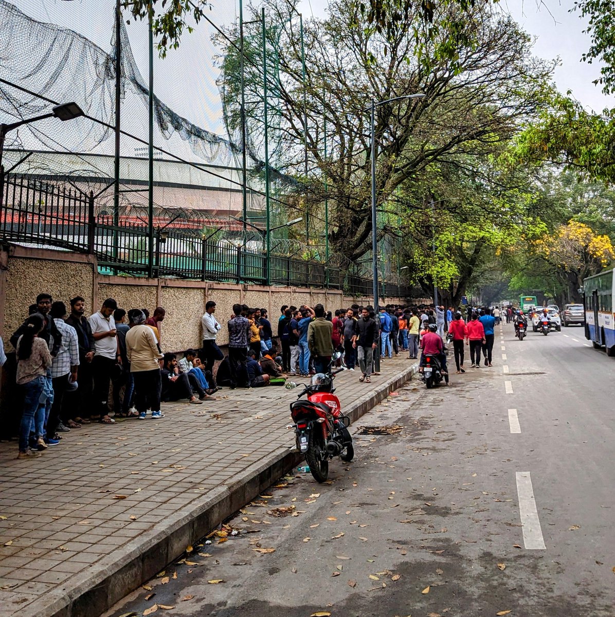 ashish430's tweet photo. Crazy Scene at M. Chinnaswamy Stadium for buying IPL tickets. People have been standing in line since 3 am. Let's hope most of the cricket fans get tickets. 🏏
#IPL2023 
#IPLtickets 
#RoyalChallengersBangalore 
#Bangalore 
#Cricket https://t.co/CNhyOuOksD