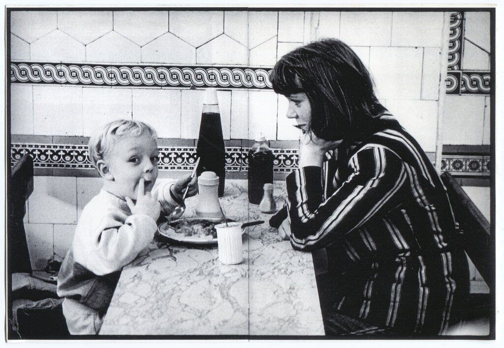 From our photo archive, a mother sits patiently whilst her child finishes their pie &amp; mash. Taken in our now closed shop at 600 Roman Road in the 1980s, it showcases the unique Minton Hollins tiles which covered the walls. 

When we refurbished our shop … instagr.am/p/Cp7XTKHMdBF/