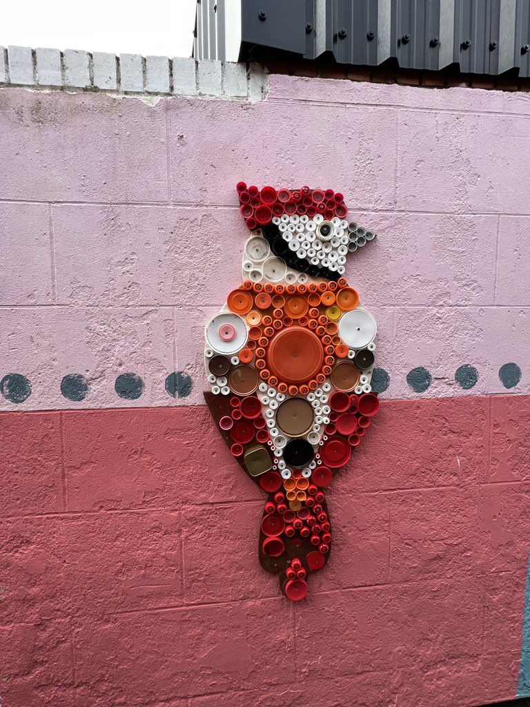 JordanCReeve's tweet photo. Whitley Bay Alleyway (all made from plastic lids) https://t.co/z52puyTsa5