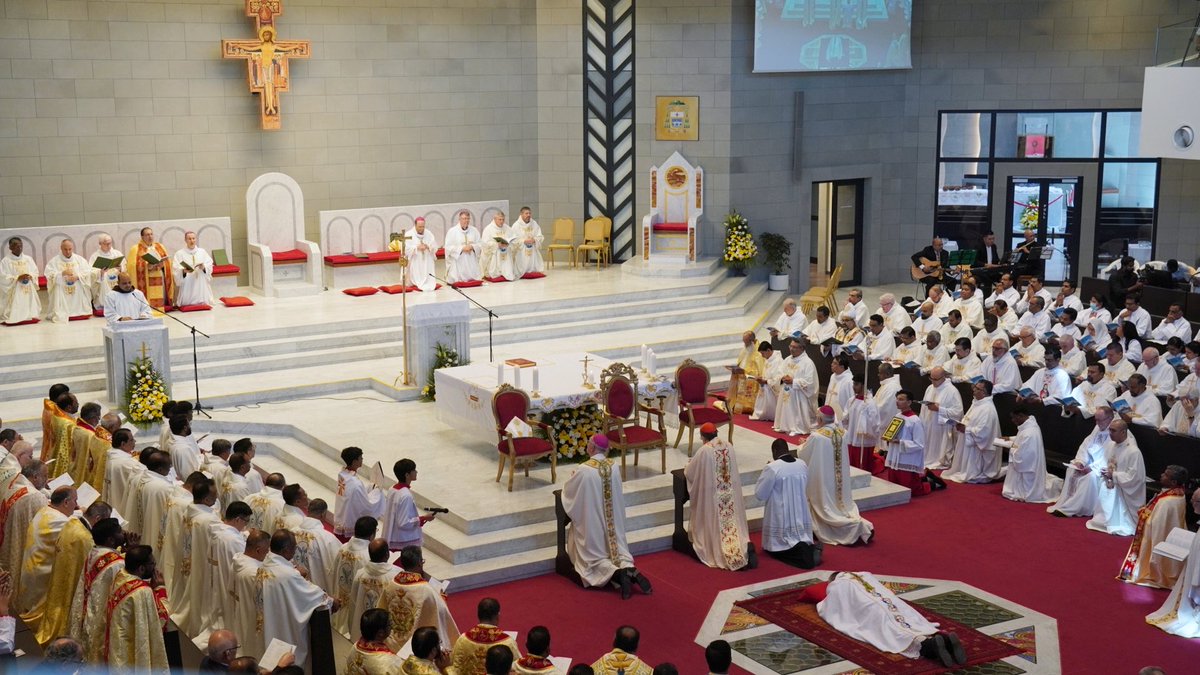 avonacatholic's tweet photo. Bishop-Elect Aldo Berardi prostrates before the altar at the Our Lady of Arabia Cathedral as the Ordination Rite begins. #AVONA https://t.co/KvLZq1IasO