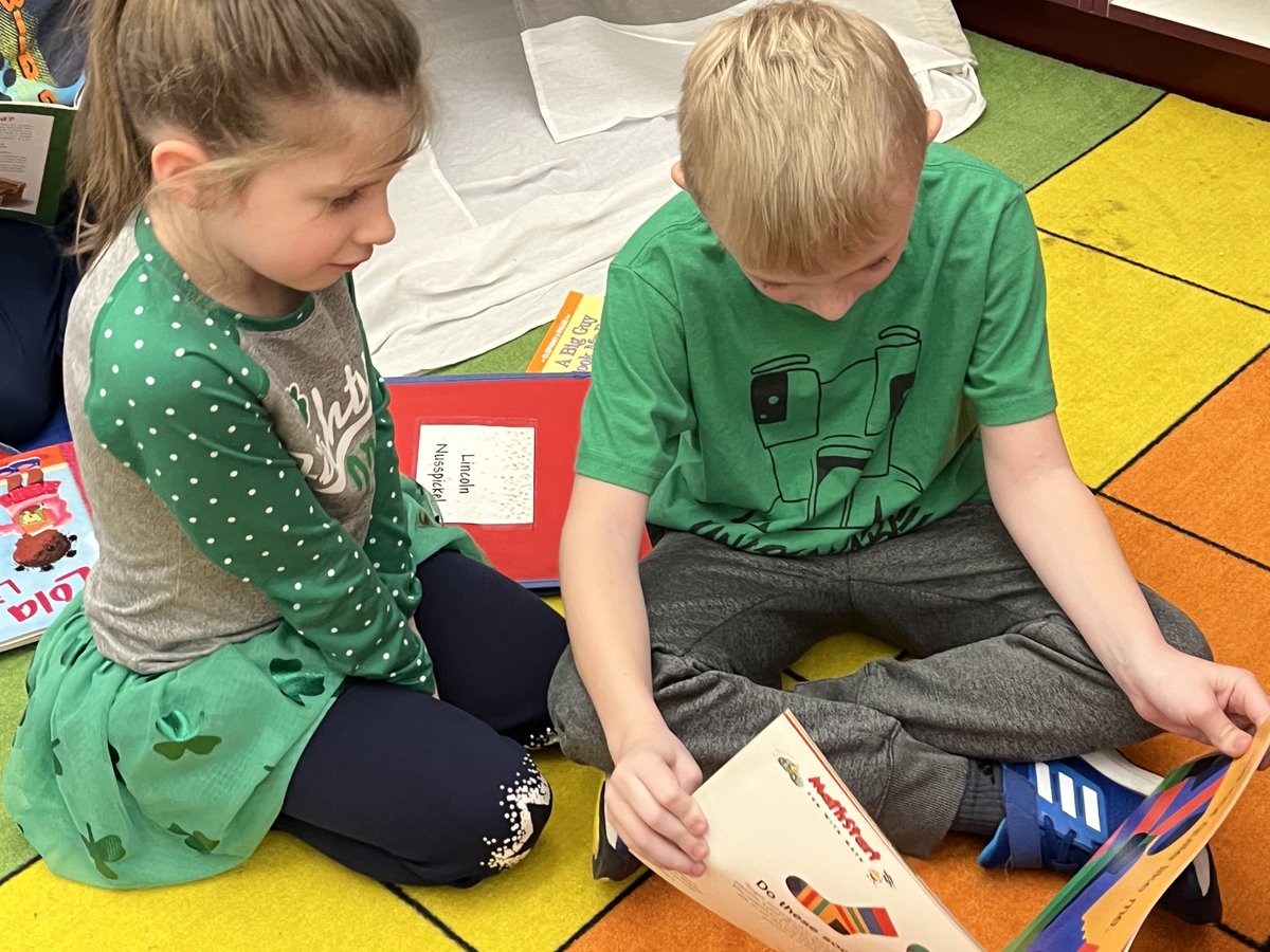 Partner reading with kindergarteners to celebrate the end of the unit “Meeting Characters and Learning Lessons”.