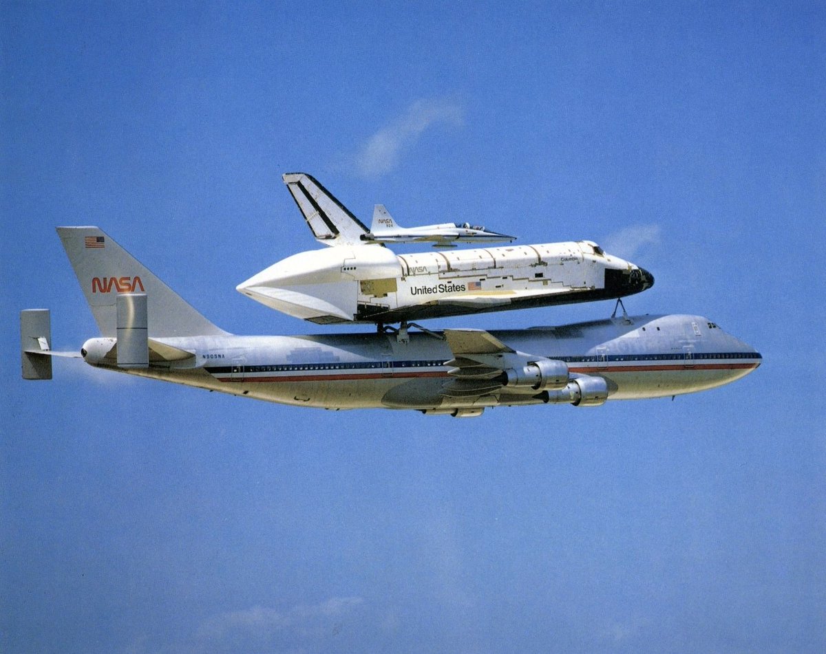RAF_Luton's tweet image. Photo of the Day: A380 carrying the Saturn V Shuttlebus with its Mig 28 escape pod attached. Note the "Wide Load" markers fixed at the rear of the upright wing of the A380 and "Go Faster" stripes that gave it a top speed of 800.85mph

Photographed from a Canberra