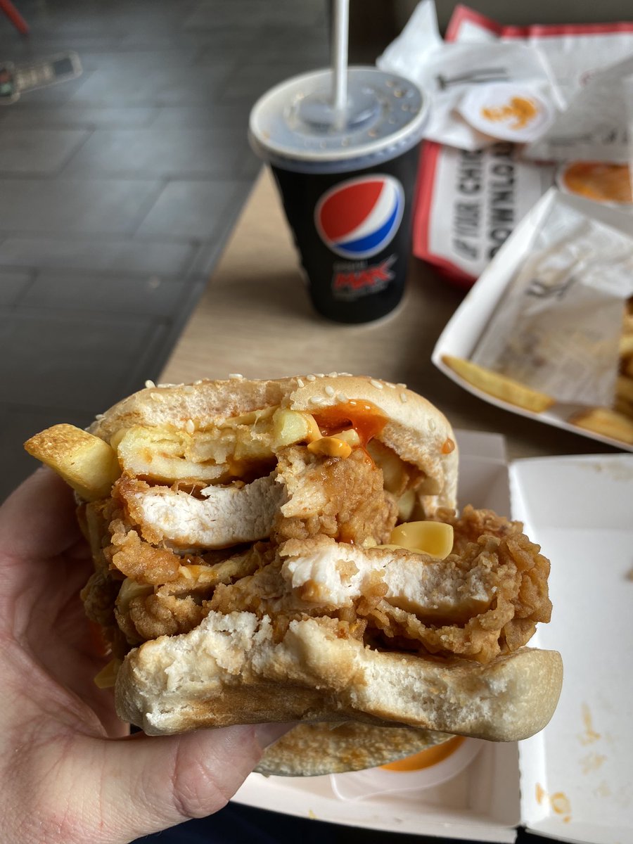 centristjim1's tweet photo. The best KFC burger money can buy. Get a Zinger Stacker burger. Add shit loads of supercharger sauce and garnish with chips 😍 not weighing myself for a week after this 😂 #dirtyfood https://t.co/JGaVwVSItn