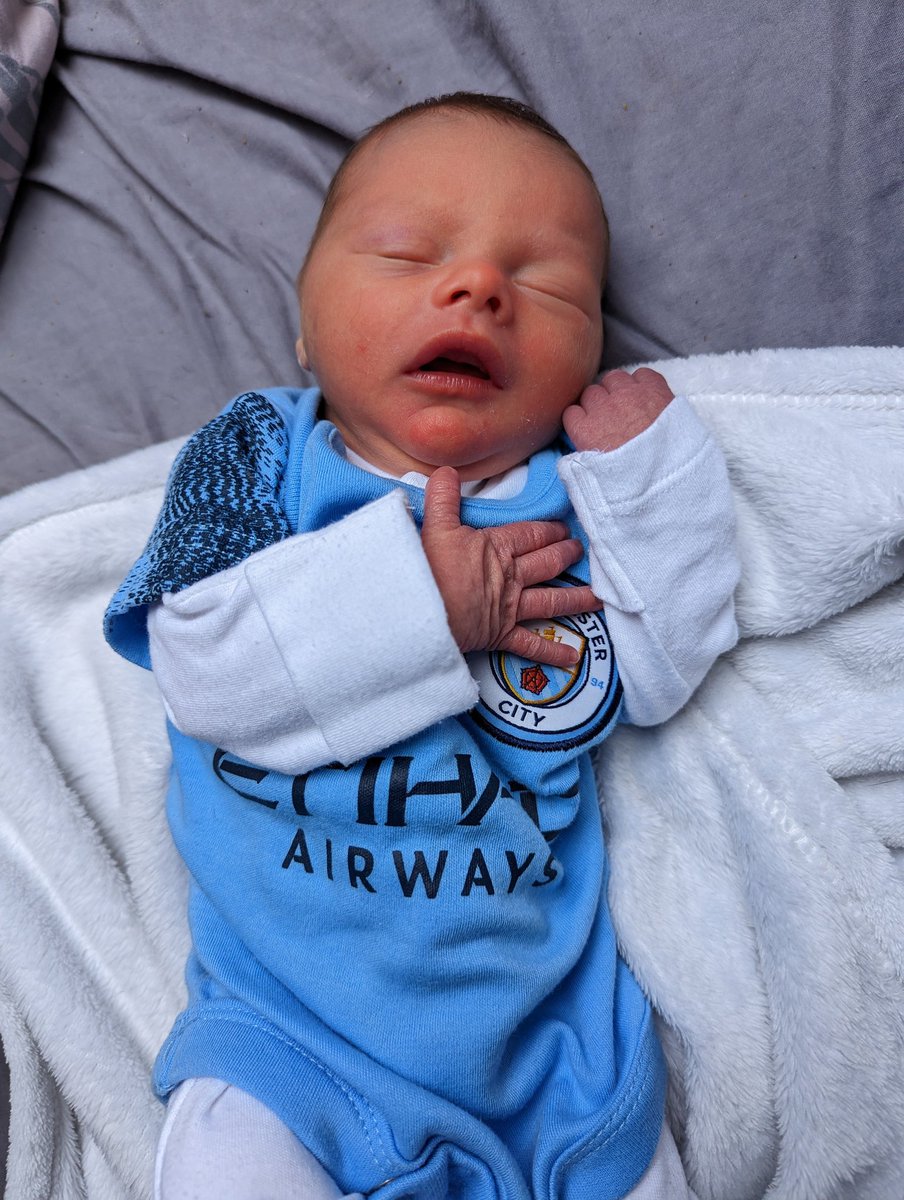 Emily_Boon's tweet photo. My new little blue 💙 born on Monday, watching football Saturday ⚽  @ManCity #mcfc #city #dadsnothappy #ctid #bluemoon https://t.co/m4Kiq19AMp