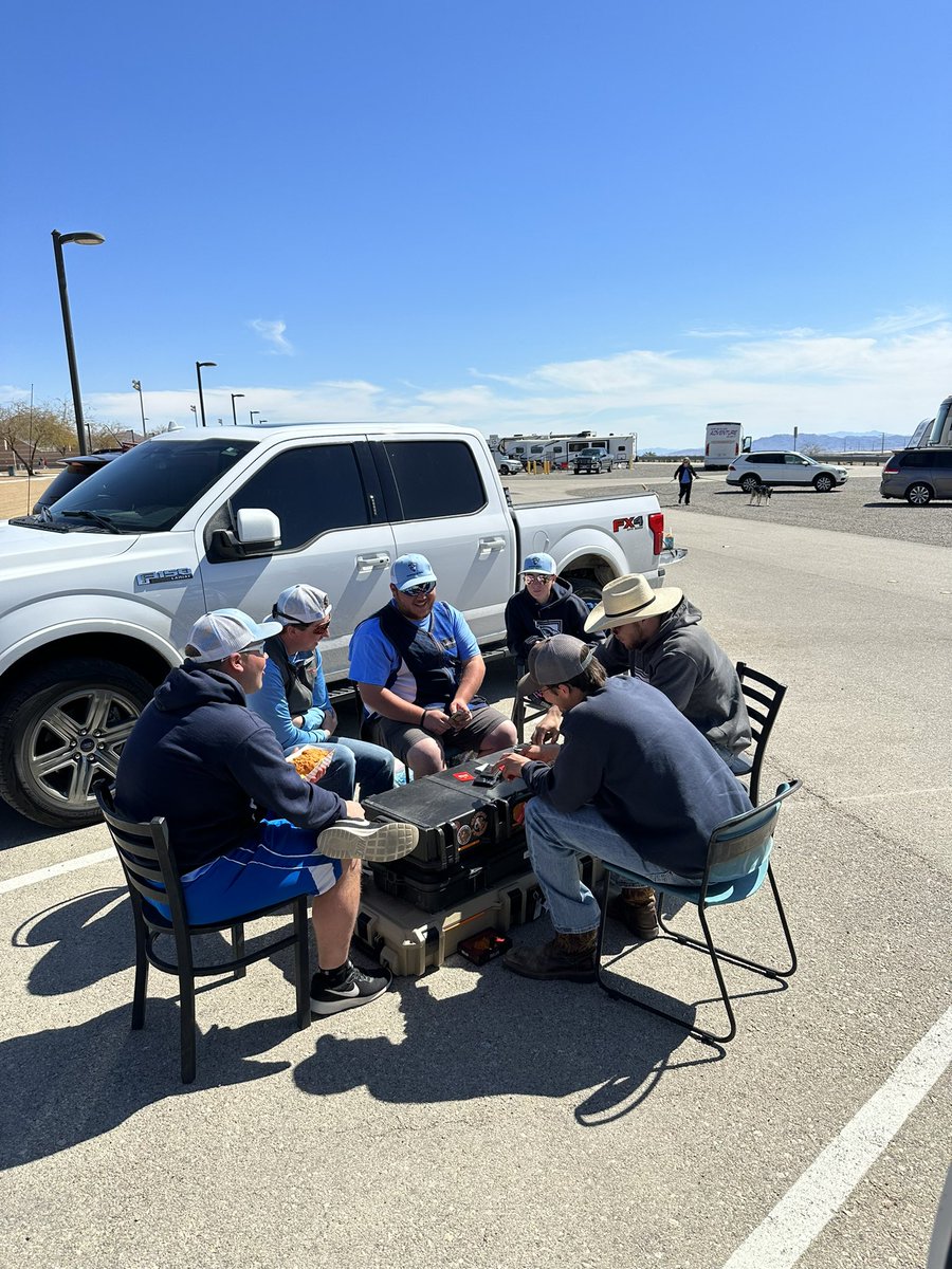 Playing cards while waiting for sporting clays
