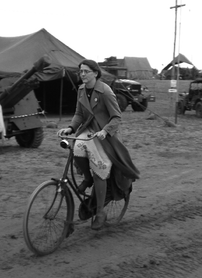 Just me cycling on my 1937 Simplex, through an allied army camp.