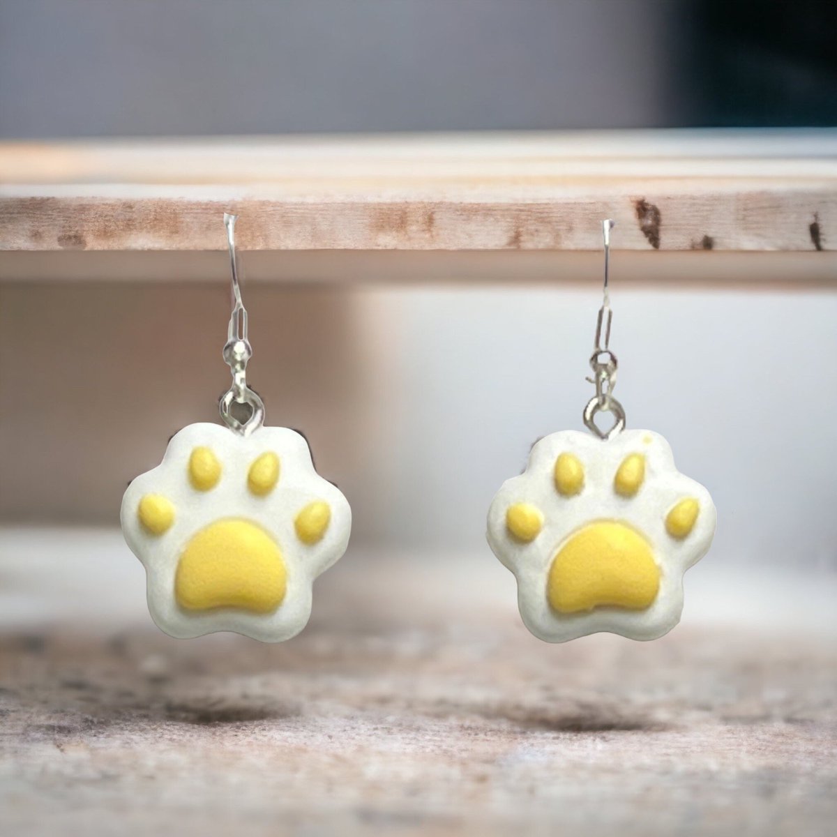 Excited to share this item from my #etsy shop: Yellow Clay Resin Paw Silver Plated Fish Hook Earrings etsy.me/3Jtt52B
#pawearrings