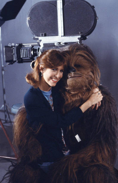 RT @NotablePics: Carrie Fisher and Peter Mayhew in costume as Chewbacca, 1983 https://t.co/bfKTqaWcof