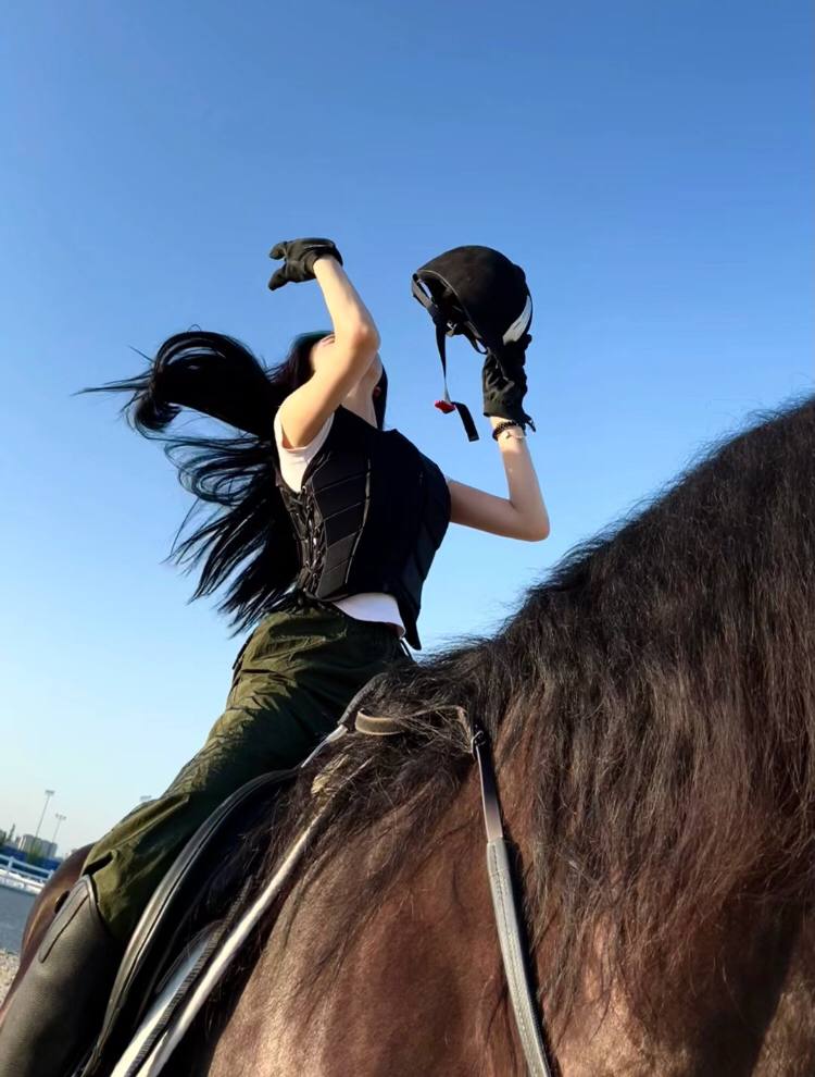 A person, a horse, clattering hoofs and wordless sighs across the sharp sky.