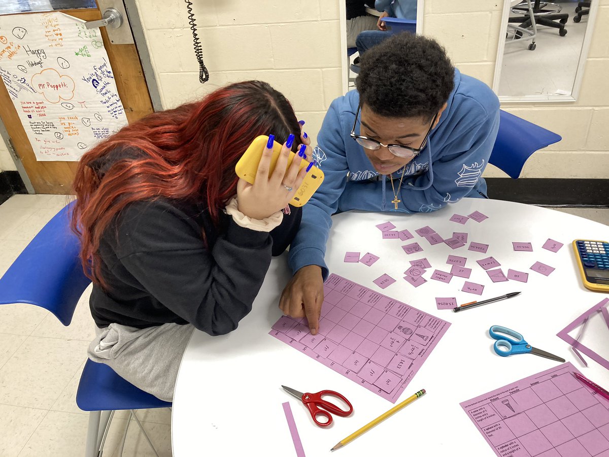 Students in 8th grade math finding the volume of three dimensional figures and identifying appropriate units³.