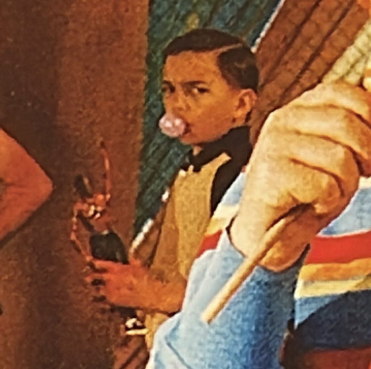 Travis Scott - ASTROWORLD (2018)

in the back next to the Travis inflatable, you can see a kid carrying the figure from the Rodeo album cover