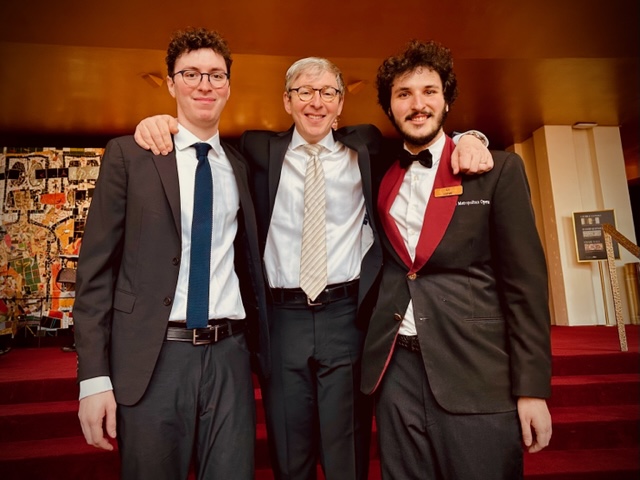 Last week, @MetOrchestra principal trumpet David Krauss had what he called a “surreal” moment while performing Verdi’s La Traviata, joined by his son Noah (left) in the pit subbing on cello while his son Eli (right) was ushering in the opera house.