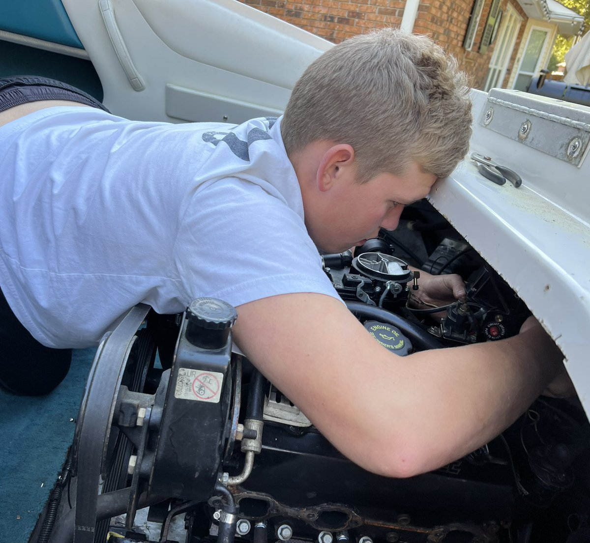 shannatou's tweet image. What is @rktouchstone doing in his “free time” when he’s not on the baseball field?? …Getting his boat river ready! #greasemonkey #pricelessexperience #rebuildingthemotor #bringonsummer #chaparral #riverlife