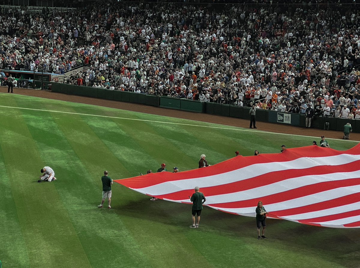 Shawn_Spradling's tweet photo. Wanted to share one of my fav pics from the WBC.

As lineups were announced prior to USA’s opening game in Phoenix, the crowd was fixated on the dugout. But the starter Adam Wainwright was in the outfield, on his knees, praying.

It just felt like a very special, intimate moment. https://t.co/Ch4saV1yq6