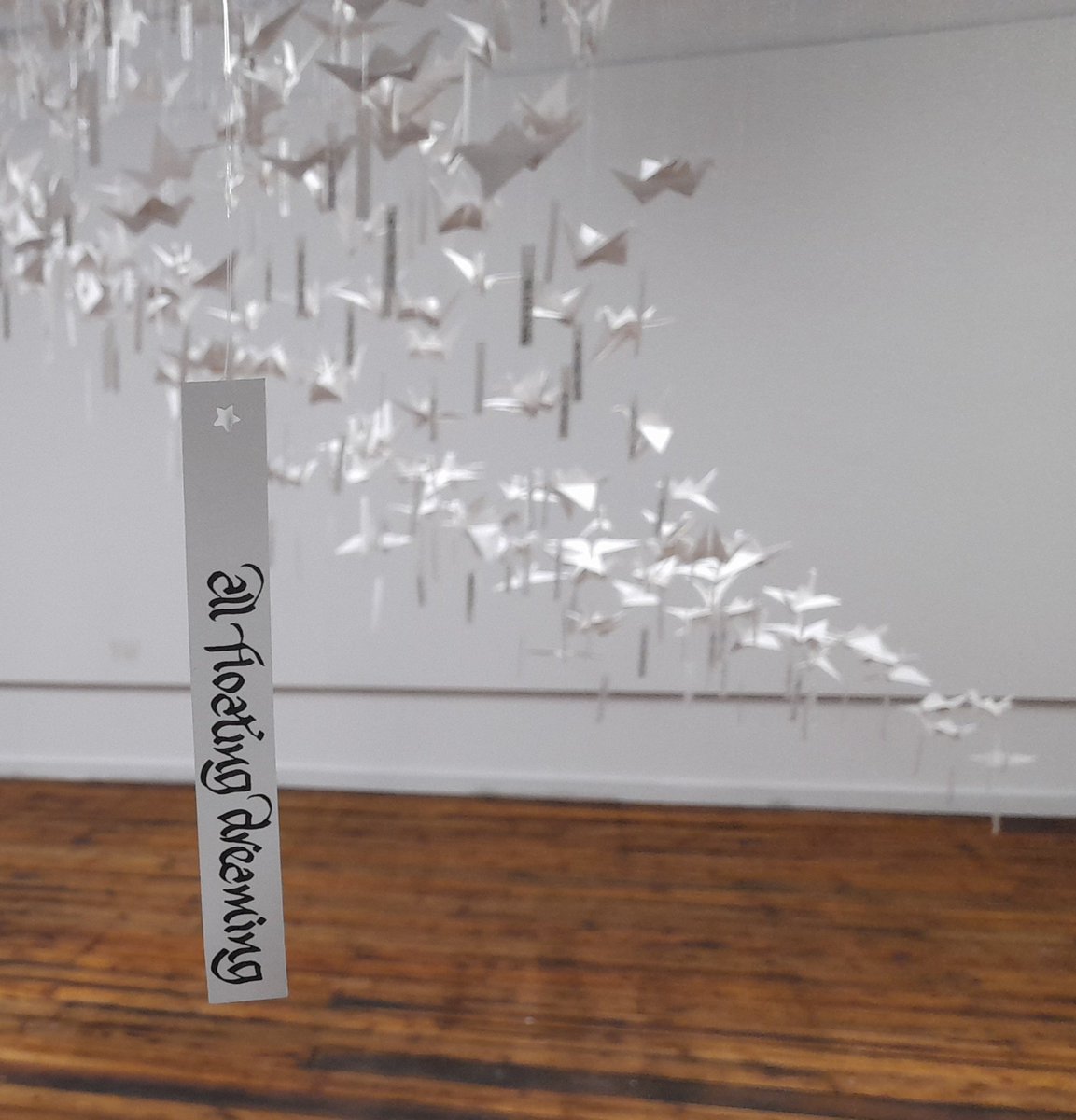 BrianTheScriber's tweet photo. Here are 1,000 paper birds on my bench @CrossStreetArts Each bird will carry a line from a haiku created in @louisethepoet workshops. To be shown in a beautiful huge murmuration @SpinnersMill starting March 25th. Come, see, It will be a visual wonder... @Healthy_Arts @TNLComFund https://t.co/Hg5IFbmu6b
