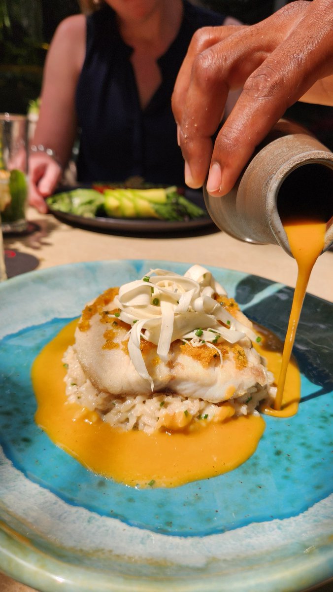 HowieSouthworth's tweet photo. I've often said that I could live on #fish and #rice. Colombia makes this a piece of cake. Fish-flavored cake. Ha. One of my finest meals in Colombia, @carmenrestaurante in #Cartagena! #Seabass #plantain #crust #coconut #risotto #heartsofpalm #ribbons #peachpalm #sauce. Bomb. https://t.co/0rybD0RiYZ