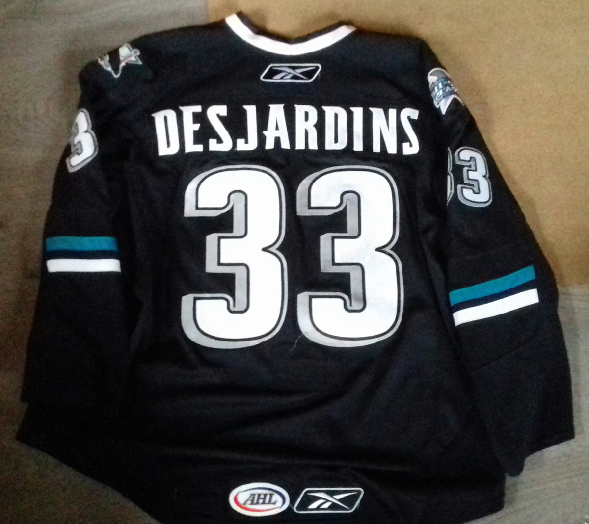 NostalgiaEagle's tweet photo. A landmark for me: #GameWorn 08-09 Worcester Sharks home set 1, worn by @AndrewDesjardin, who played the most consecutive games (188) for them. Desjardins won the Cup with the Blackhawks in '15 and played 5 seasons for the Adler Mannheim, including the championship season 18-19. https://t.co/UYw7PInZZH