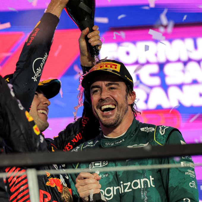 Fernando Alonso celebrates on the podium