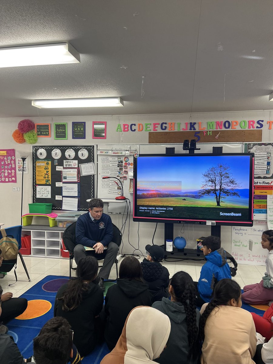 RosaCoss1's tweet photo. Kicking off Read Week with our guest reader Dr. @smith2dw !Thank you for taking time out of your busy schedule to come read to us @GuilfordEle #readweek https://t.co/lZexpcWzjm