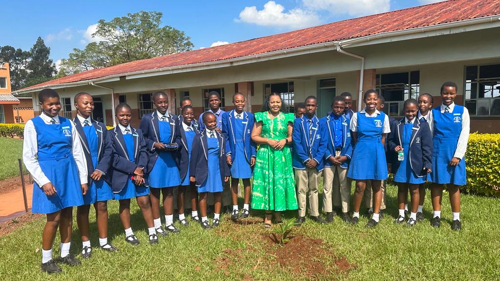 EswatiniGovern1's tweet photo. [PHOTOS]: Minister of Justice and Constitutional Affairs Pholile Shakantu plants trees at St. Mary's High School in Lobamba as part of the ongoing national tree planting campaign. https://t.co/IhY3YqJpGR