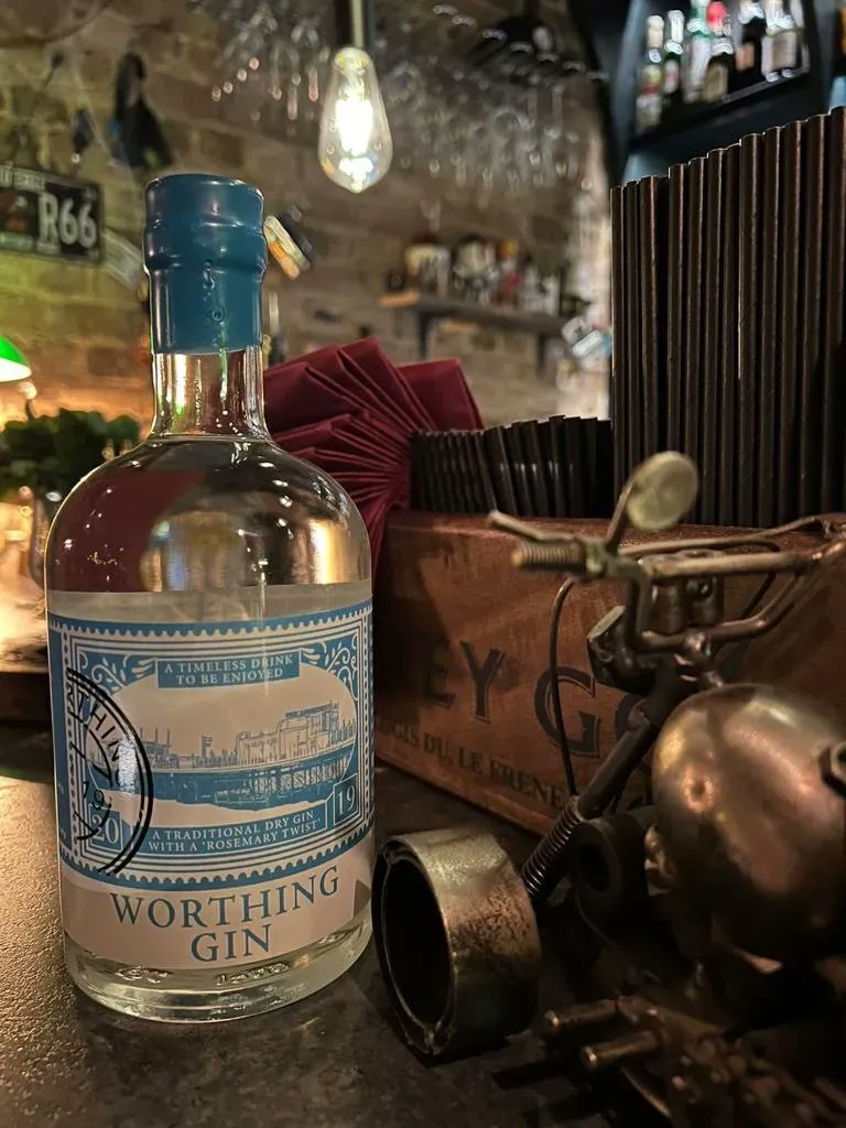 WorthingGin's tweet photo. Proud to be served at #fivedots #worthing 
Thanasis - the manager of FiveDots, the speakeasy bar on Chapel Rd ollected a couple of bottles of Worthing Gin for the bar.  FiveDots is a fabulous place. Enjoy one or two of the 40 cocktails on the menu (including some with gin 💕). https://t.co/VjRxxY4o3I