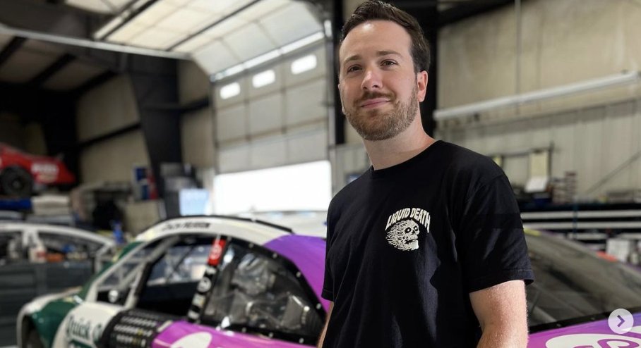 Queerty's tweet photo. NASCAR racer Zach Herrin is using his rainbow-colored car to fight “Don’t Say Gay” laws. Presented be @Nissan. #PartnersofProgress https://t.co/A5DFWiMaqt https://t.co/MNFUiPn8Fg