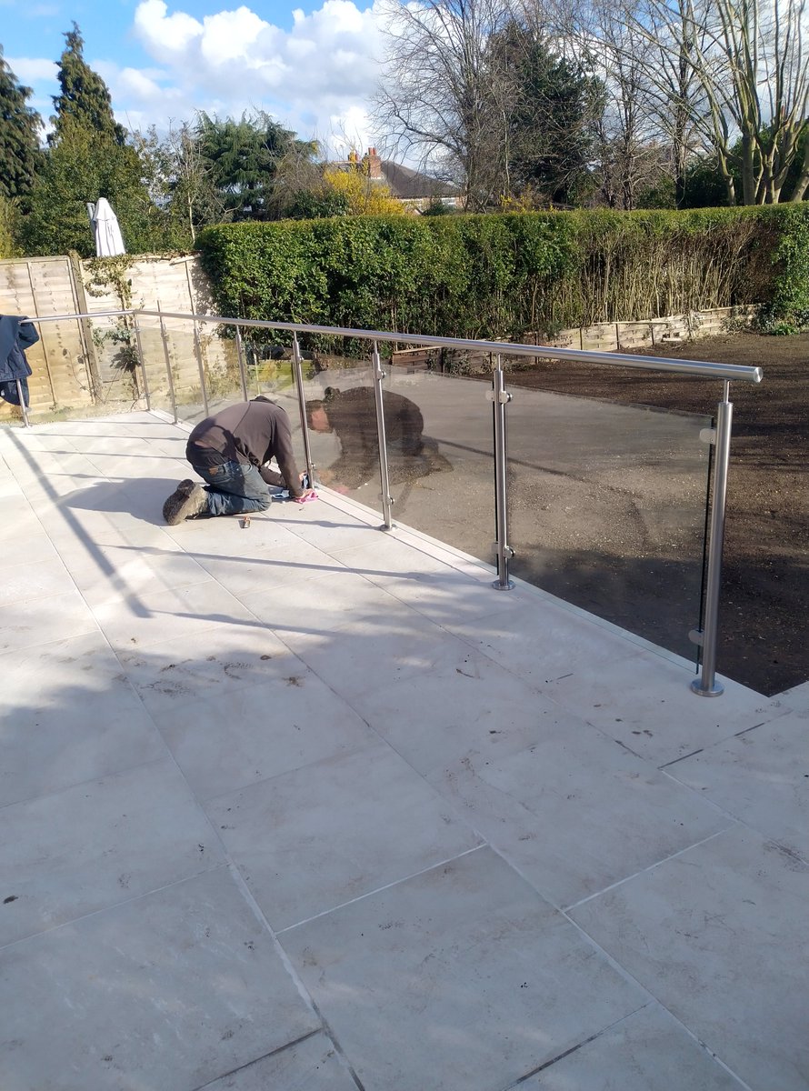 Giving the stainless steel balustrade a final polish #landscaping #gardendesign #Nottinghamshire