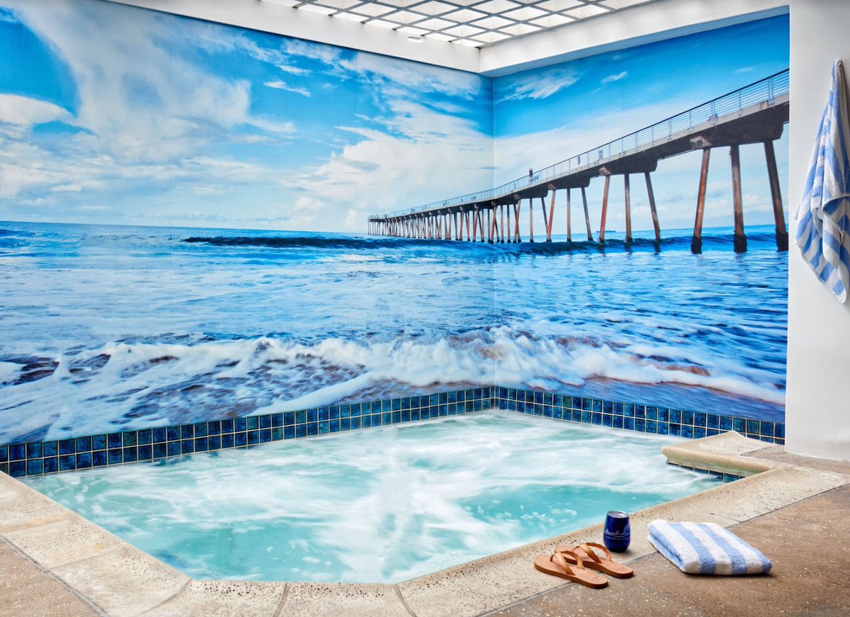 BeachHouseHotel's tweet image. After a day on the Hermosa sand or strand, unwind with a soak in our relaxing hot tub. Your steamy and scintillating Spring Break experience starts at the link in our bio. 

#ImageDescription: An indoor jacuzzi bubbles vigorously in a corner decorated with a photo mural of the...
