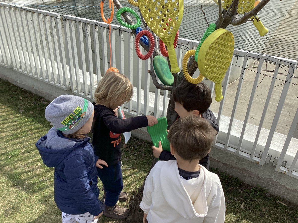 “We play Christmas Tree. These are decorations.” Negotiation, sharing ideas, collaboration, imagination with EC4 friends. Wonderful to see and hear them at outdoor recess. #symbolicplay #creativeplay #outdoorplay <a href="/AISBucharest/">AISB Bucharest</a>