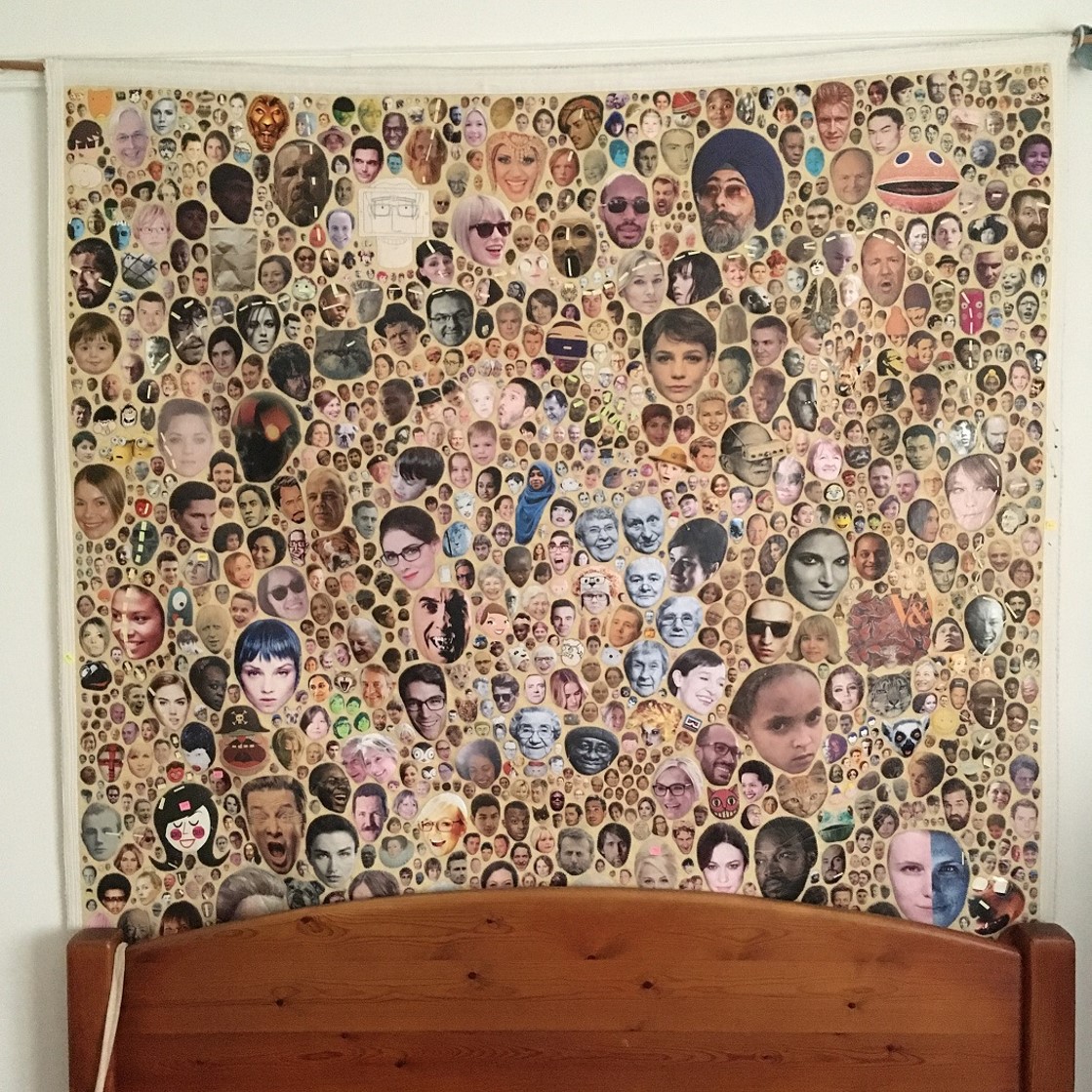 aye_alison's tweet photo. On the first day of 2014, I started stitching 'junk mail' faces to a blanket. I finished it towards the end of 2015. 147 x 147cms. Approx 1600 faces. It has been hanging behind our bed for the best part of a decade #mostlyuninvited https://t.co/u7orxU74K4