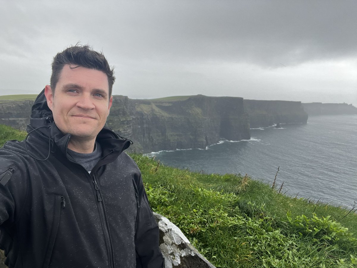 Was a little rainy and windy… and literally just ran to the edge for a pic before leaving… but, there she is. Impressively high. #cliffsofmoher #Ireland #irelandscenery