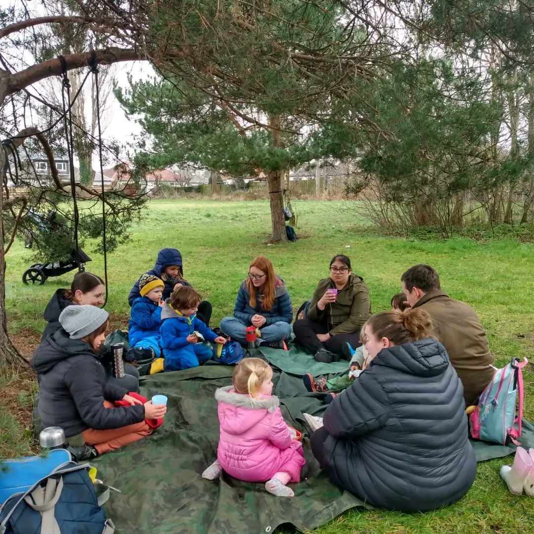 Parents and preschool children enjoying #outdoors on a dreich day #Outdoorplay #natureplay looking for bugs and fairies #getoutside #playmatters #playeveryday #PLAYOUTDOORS