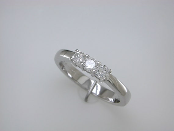 lustigbrothers's tweet image. Three round diamond stone in white gold engagement etsy.me/3PR0abu #diamondring #rounddiamondring #roundengagement #thindiamondring @etsymktgtool