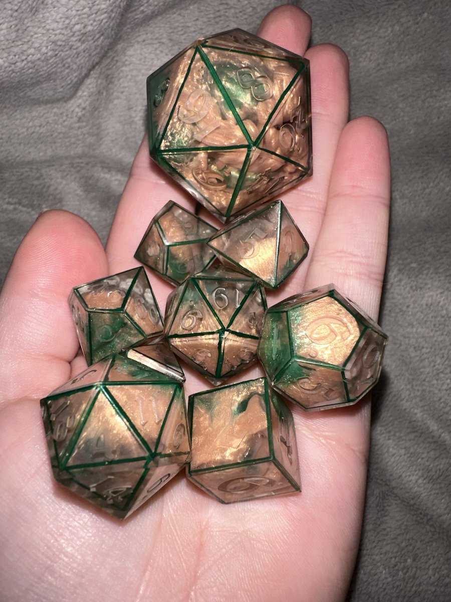MapleMothDice's tweet photo. It’s been a bit since I saw something and was inspired to make dice because of it, then I saw @navarroc0821 ‘s absolutely beautiful character F.R.I.D.A and I was just absolutely floored. So here is my F.R.I.D.A dice set, not yet inked.
#criticalrole #polyhedraldice #handmadedice https://t.co/4itQAirMKa
