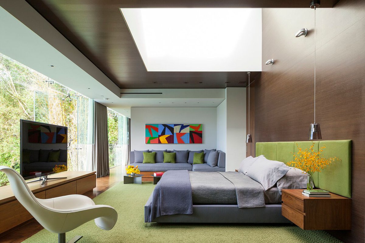 An overhead skylight and floor to ceiling glass walls bring natural light to the modern primary bedroom at our Summit House in #BeverlyHills. Photo by @rogerdaviesphotography

#bedroom #bedroomdesign #modernbedroom #luxurybedroom #minimalistbedroom #minimalism #interiors
