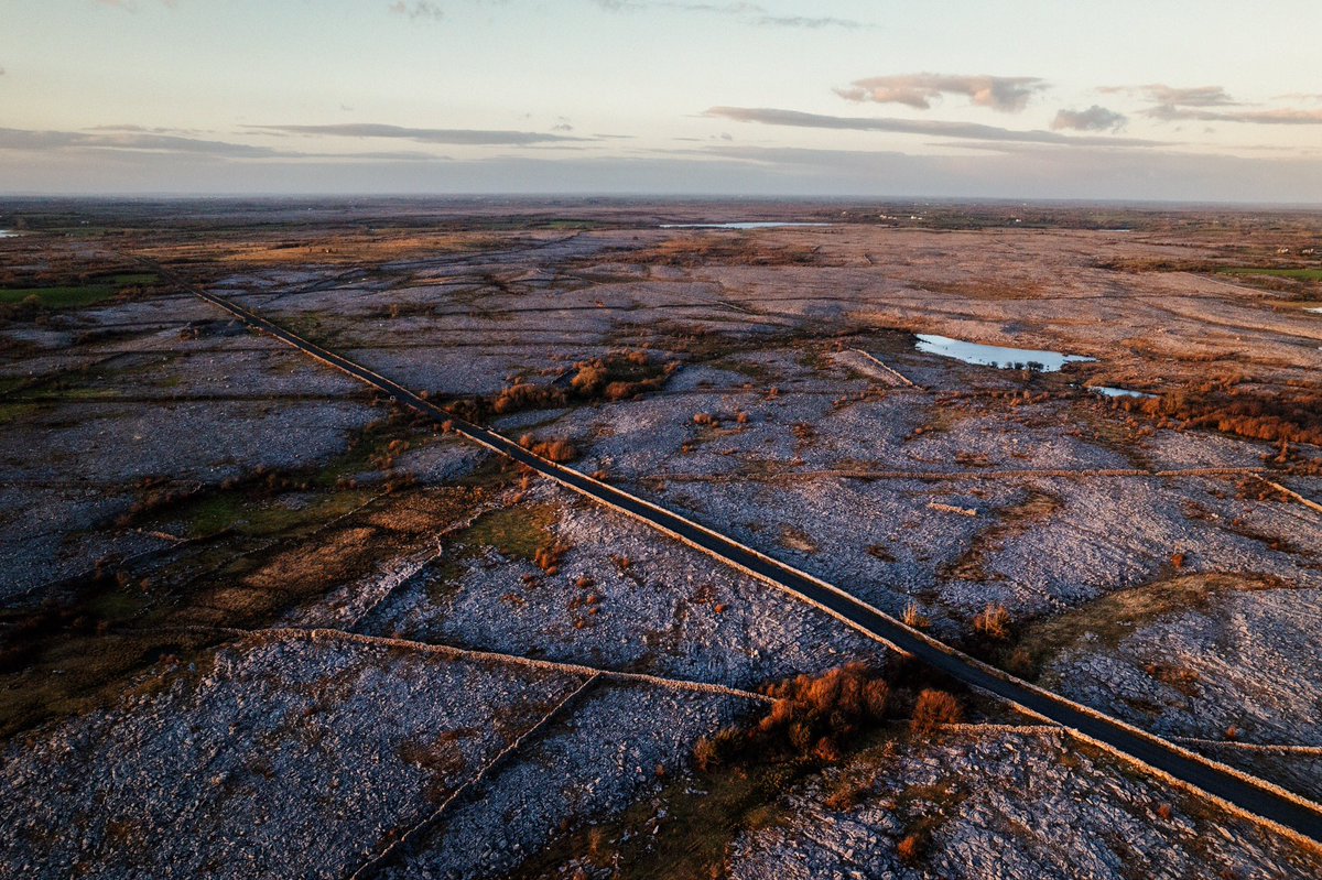 The perfect road for a road trip in the West of Ireland, The New Line. The road runs parallel to the hills of the Burren, between the village of Crusheen and finishes near Kinvara village. #roadTrip #theburren #clare #wildatlanticway #galway #thisisgalway #visittheburren