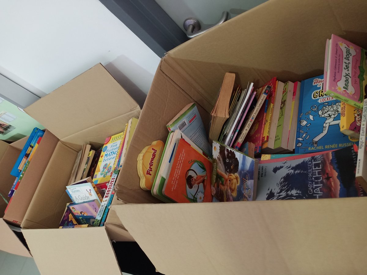 LibraryHISKL's tweet photo. Donated books are piling up!. Currently located in the foyer next to the cafe (in front of the preschool).  Come and get your books. 🎓@HELPISKL #HISBookDonation #HIS_Learning https://t.co/r3WKeXXAy8