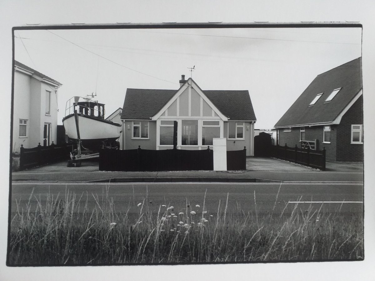 nicholas_sack's tweet photo. Curious houses no. 62
Lade, Kent, 2014
Silver gelatin print
#Kent #RomneyMarsh #Lade #LyddonSea #streetphotography #bungalow #boat #blackandwhitephotography #monochrome #analogue #film #bnw #coast #seaside #verge #grasses #road #street #gable #window #roof #fence #singlestorey https://t.co/vzY4xohtms